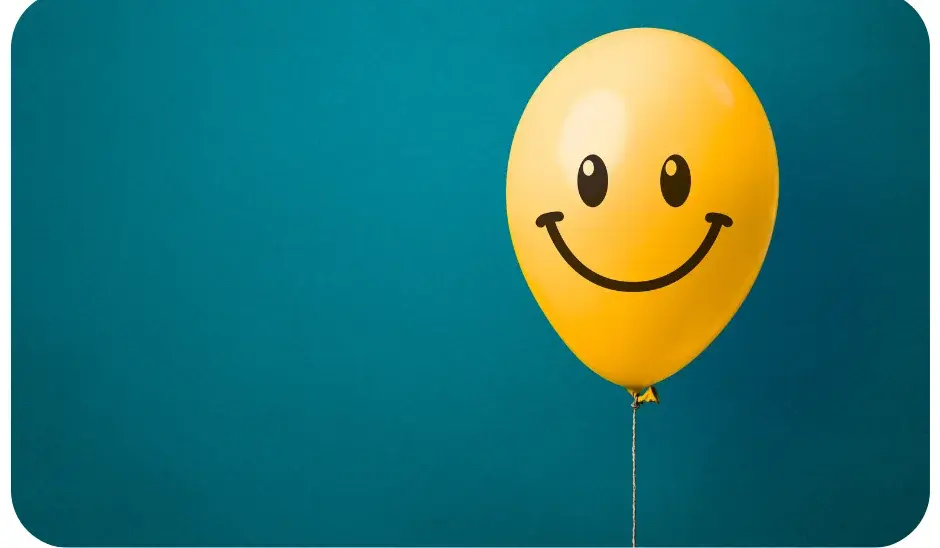 "Yellow balloon with smiley face symbolising creative design and honest pricing